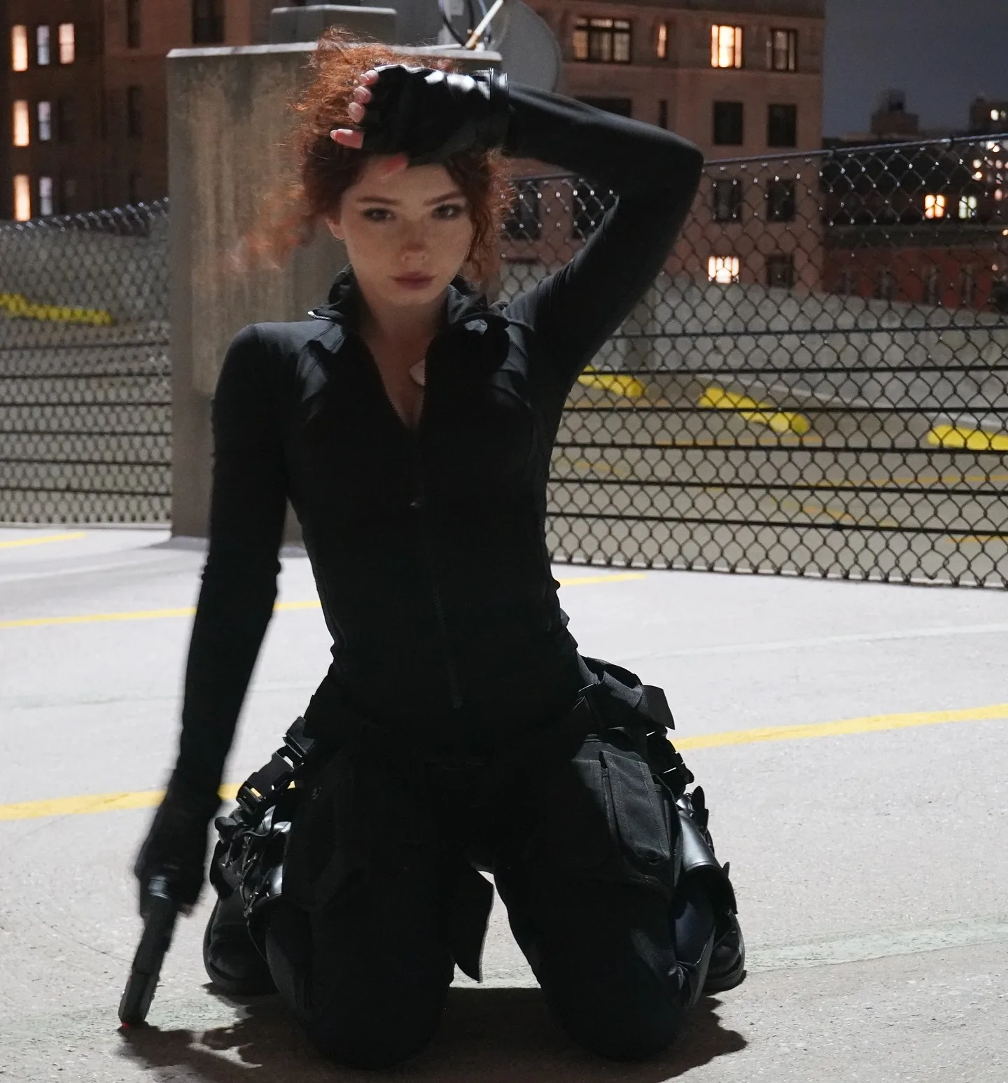 Livia Paige Black Widow Halloween cosplay on a rooftop