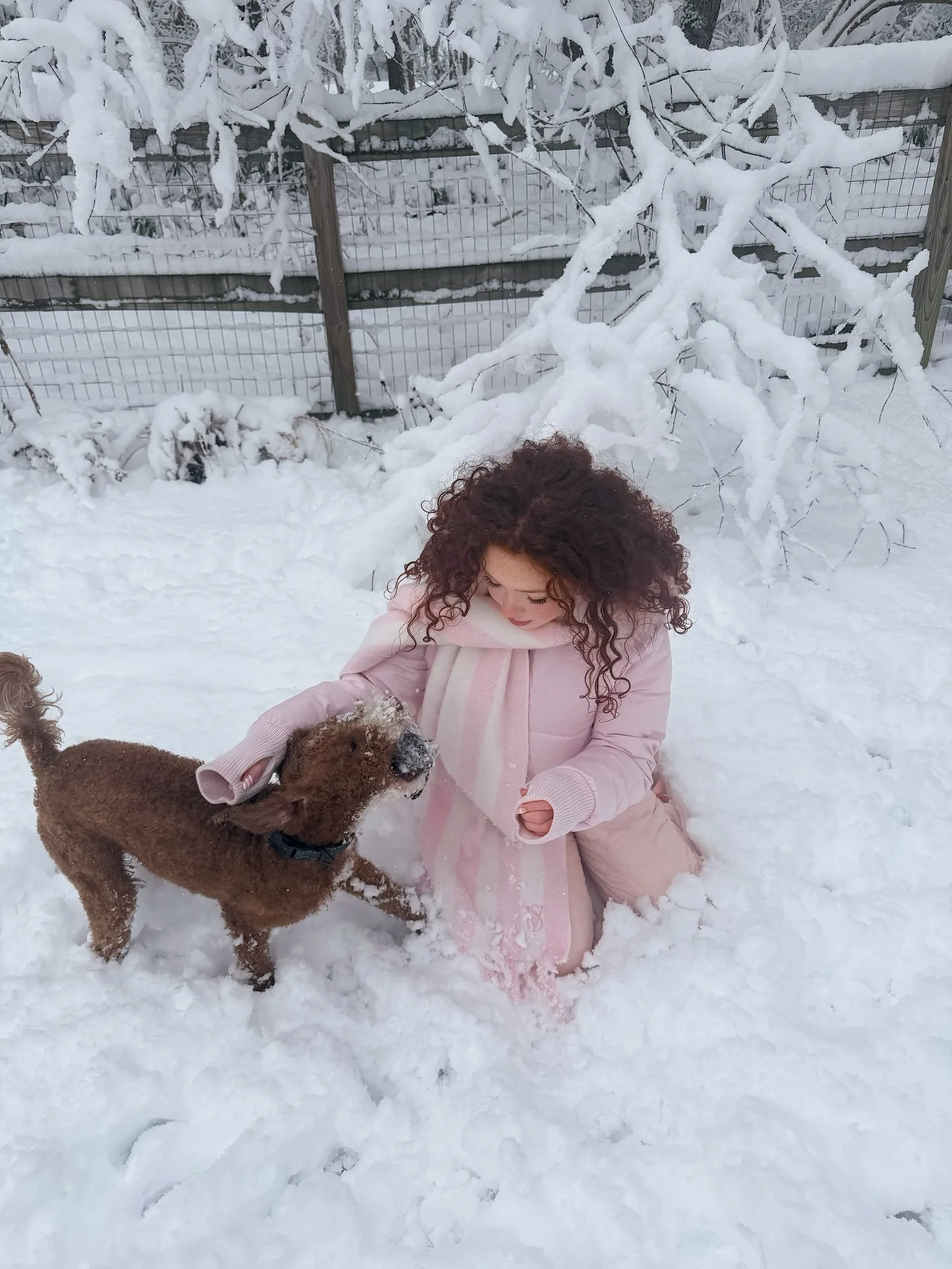 Livia Paige in a pink coat in the snow